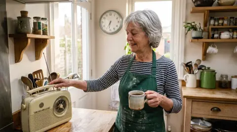Photo 1: Mom switching on the kitchen radio with a mug of coffee in her hand